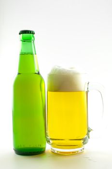 bottle and glass of beer on white background