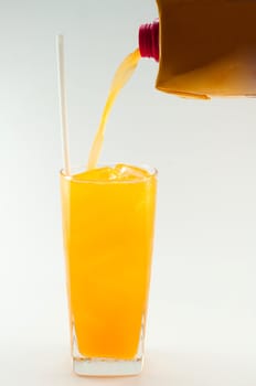a glass of orange juice on white background