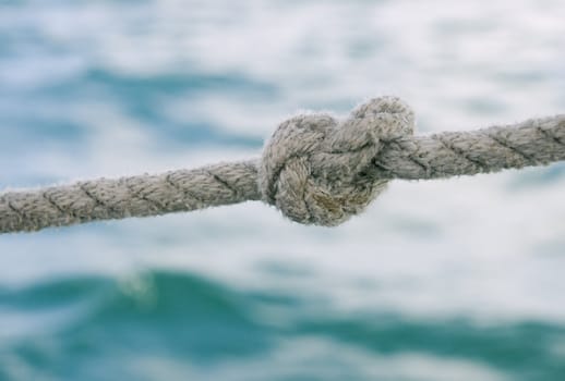 Knot on a rope against sea water
