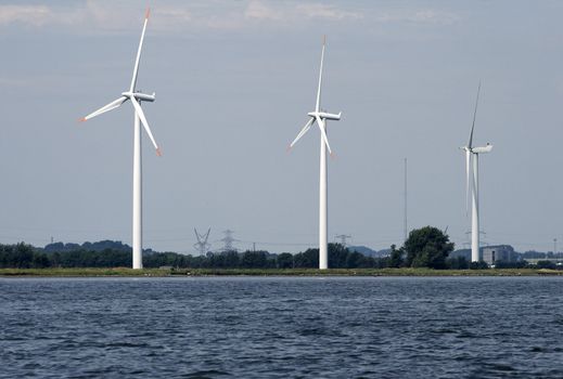 Wind generators on a river coast, Denmark