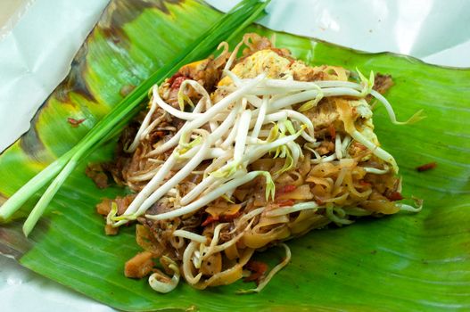 Thai noodle fried on green banana leaf