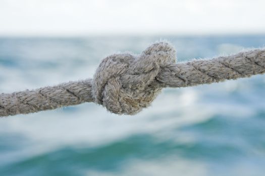 Knot on a rope against sea water