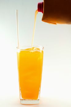 a glass of orange juice on white background