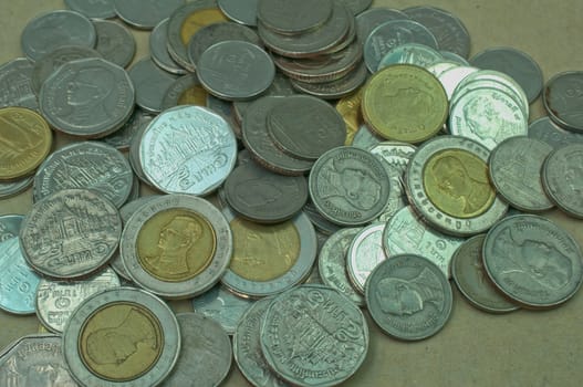 group of Baht coins on table