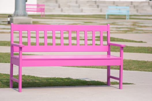 pink street chair in the park