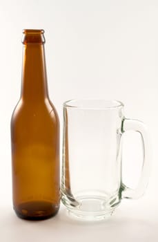 bottle and glass of beer on white background