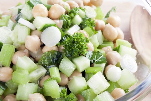 Mixture of chickpeas parsley, green onions, chopped celery and chopped cucumbers.