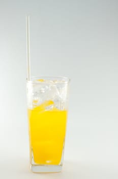 a glass of orange juice on white background