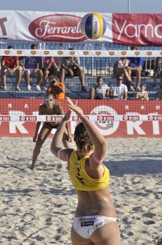 NAPLES - JULY 07: italian professional players have a competition at Italian beach volley female tournament on July 07, 2012 in Naples Italy