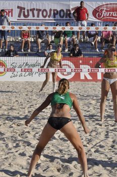 NAPLES - JULY 07: italian professional players have a competition at Italian beach volley female tournament on July 07, 2012 in Naples Italy