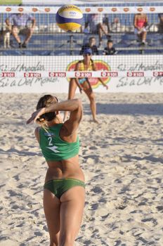 NAPLES - JULY 07: italian professional players have a competition at Italian beach volley female tournament on July 07, 2012 in Naples Italy