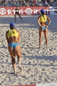 NAPLES - JULY 07: italian professional players have a competition at Italian beach volley female tournament on July 07, 2012 in Naples Italy