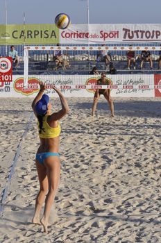 NAPLES - JULY 07: italian professional players have a competition at Italian beach volley female tournament on July 07, 2012 in Naples Italy