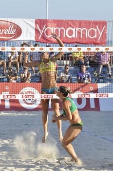 NAPLES - JULY 07: italian professional players have a competition at Italian beach volley female tournament on July 07, 2012 in Naples Italy