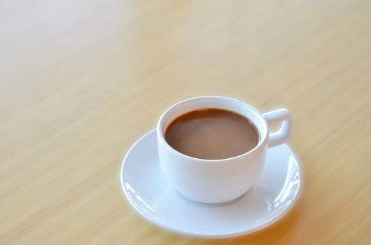 hot coffee in a white cup on table