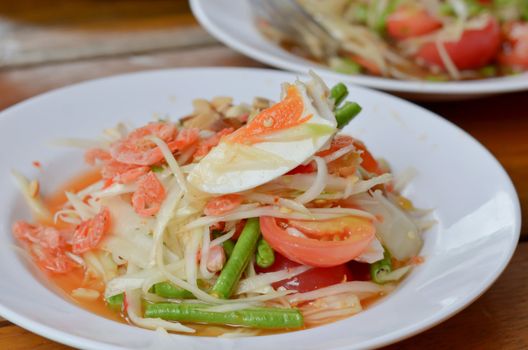 thai papaya salad hot and spicy ,mixed  vegetable ,dried salted prawn and egg