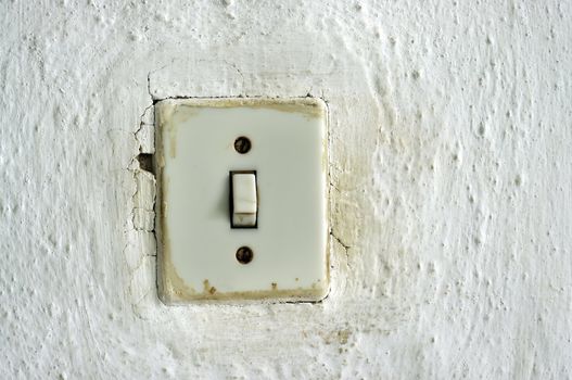 traditional old light switch on the wall