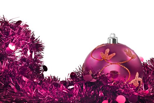 Pink chrismas decorations against a withe background with space for text