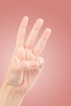 Female hands counting number three isolated on white