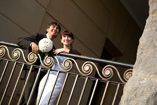 couple near the fence in the city