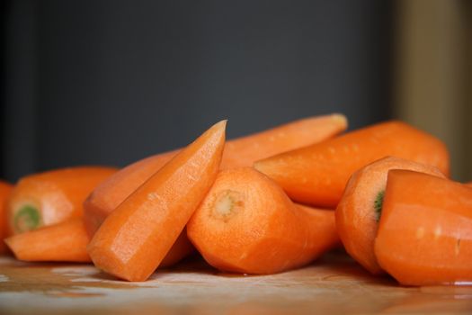 Prepared Carrots on wooden cutting board
