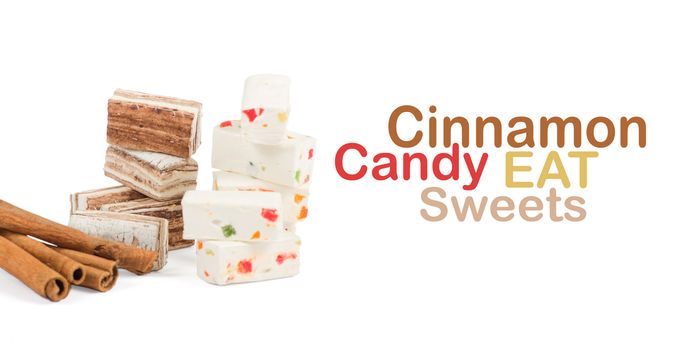 Sweets and cinnamon sticks isolated on white background