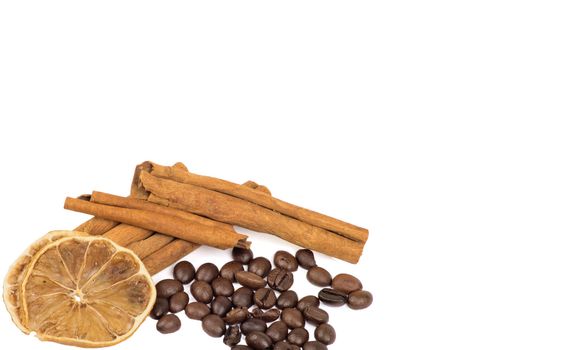 coffee beans, cinnamon and lemon isolated on white