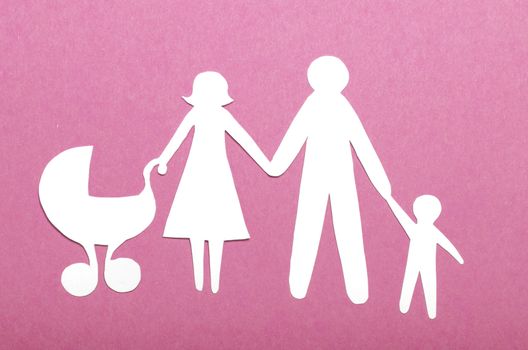 Closeup of paper family on green background