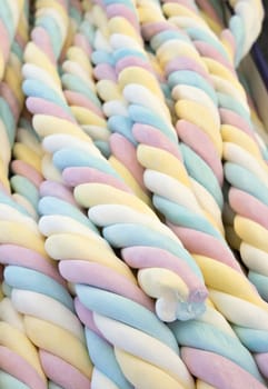 Four-colored blue, pink, yellow, white marshmallow, close up
