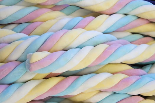 Four-colored blue, pink, yellow, white marshmallow, close up