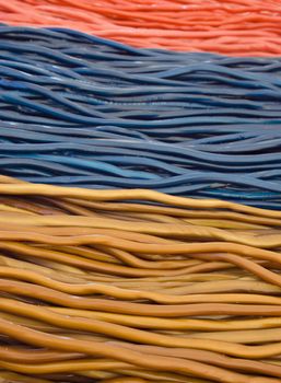 Various colour jelly sticks in a market