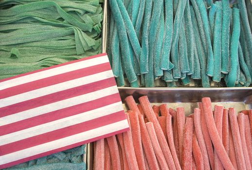 Various colour jelly sticks in a market