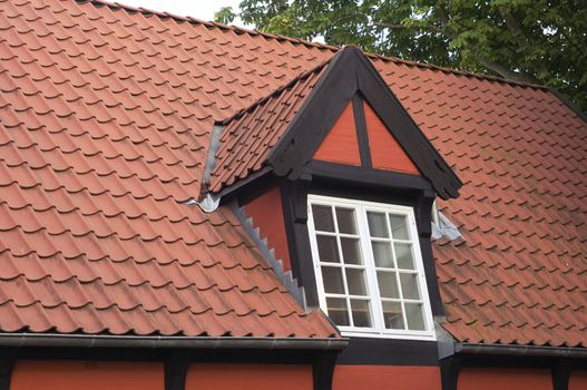 Roof with red tiling and dormer