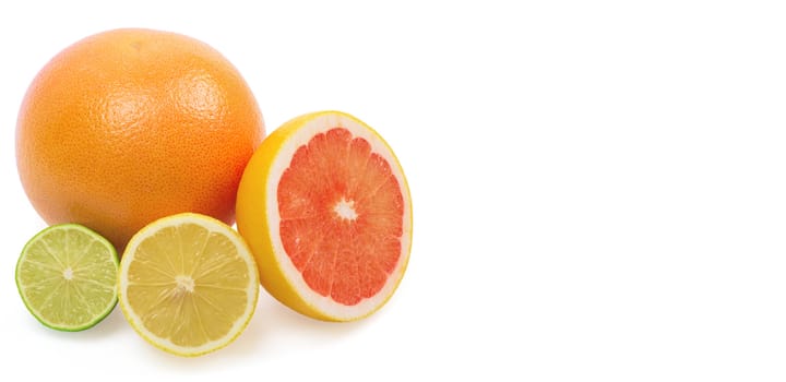 Image of a fresh whole lime, lemon and orange isolated on white