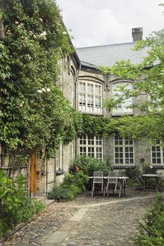 Courtyard of an old house in a summer day
