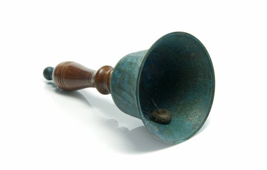 green metal and wooden bell on isolated white