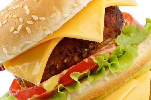 Tasty Cheeseburger with beef, tomato, letucce and cheese closeup clipping path