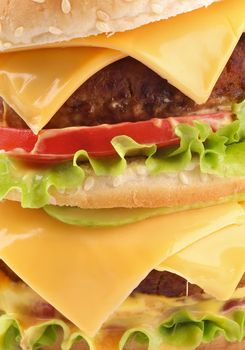 Tasty Double Cheeseburger with beef, tomato, letucce and cheese closeup