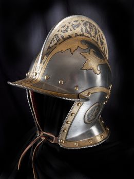 Iron helmet of the medieval knight. Very heavy headdress.