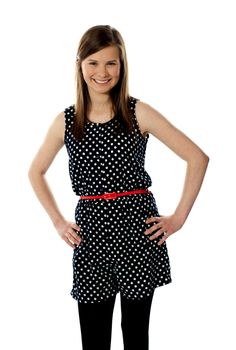 Smiling beautiful teenager posing in style isolated over white background