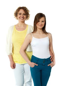 Strong relationship. Mother and daughter posing in front of camera