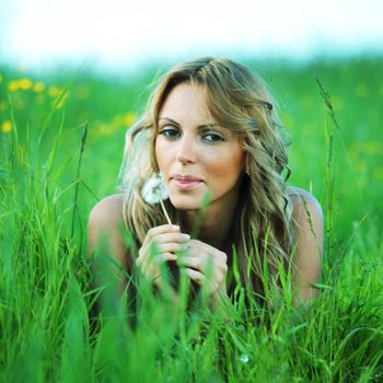 woman on the green grass happy and smile