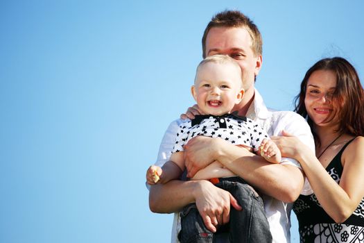 happy family blue sky on background