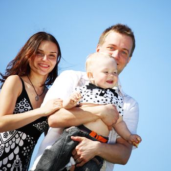 happy family blue sky on background