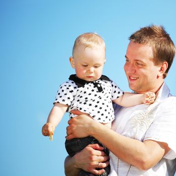 happy family blue sky on background