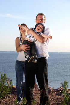 happy family blue sky on background