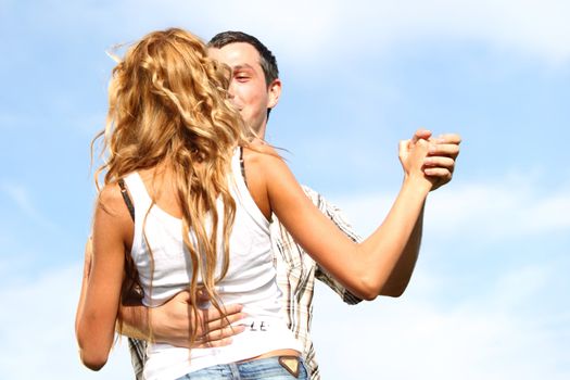 man and woman dance in the sky