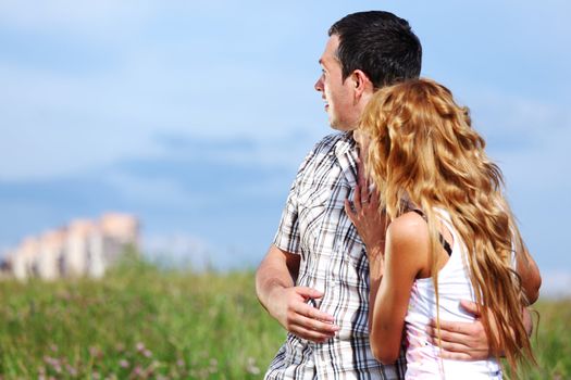 man and woman see houses and new flat