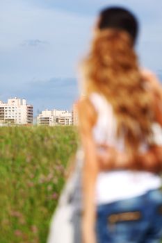 man and woman see houses and new flat