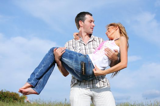 man and woman hug in the sky